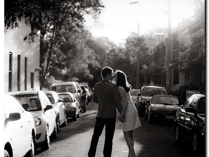 couple kissing in the street