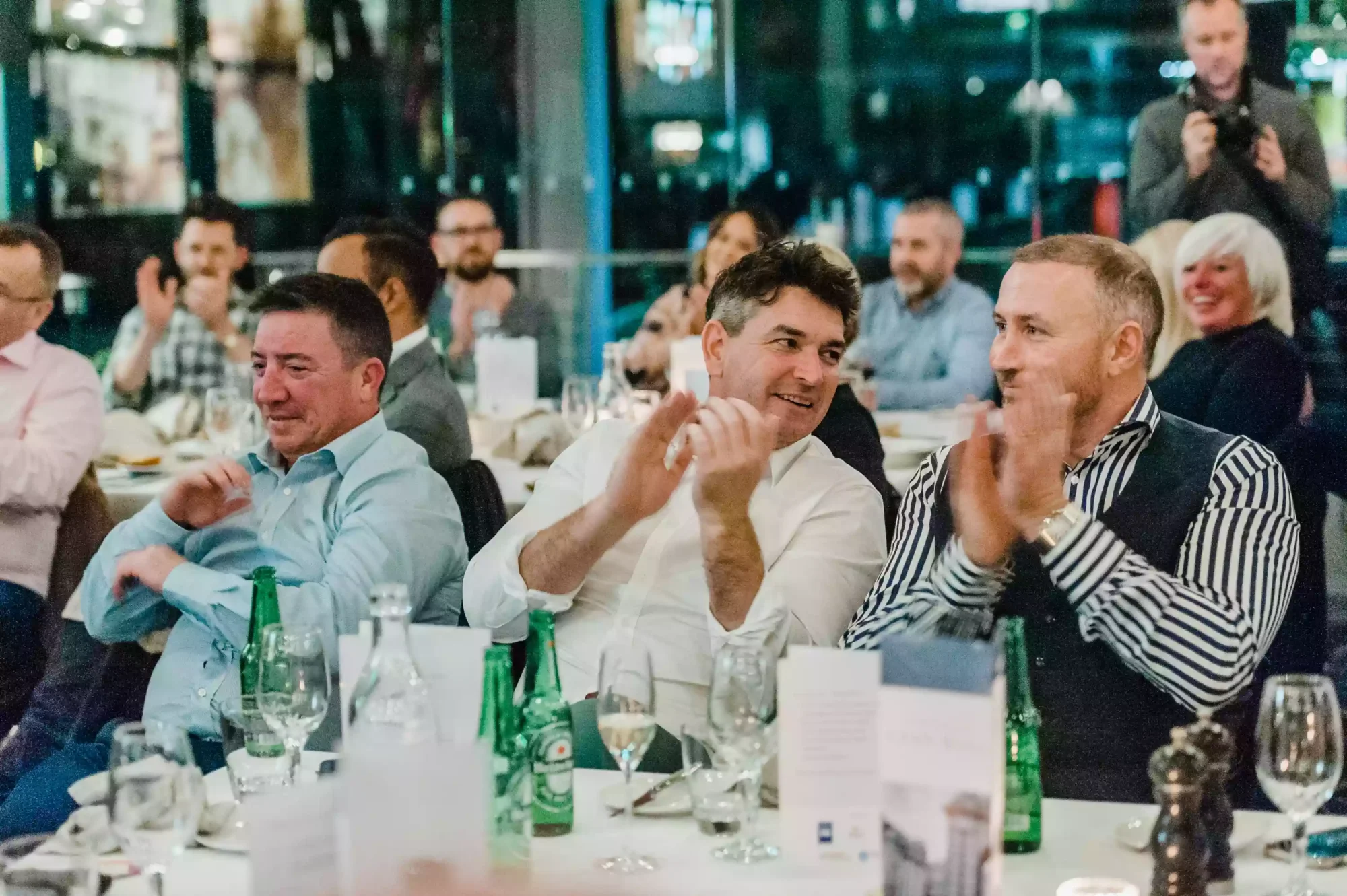 photo of a group of people applauding at a Sydney event as captured by a sydney event and award photographer
