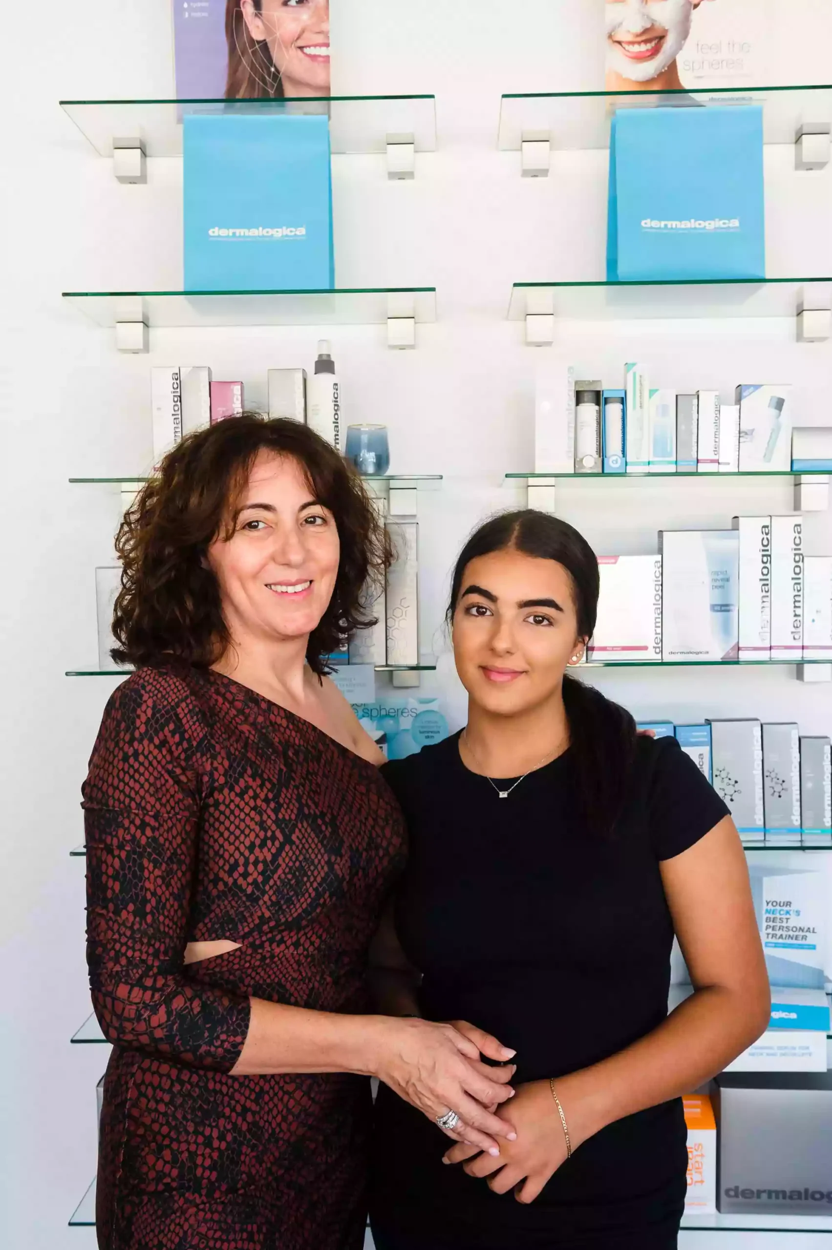 2 woman standing in front of their store counter as photographed by a sydney business photographer