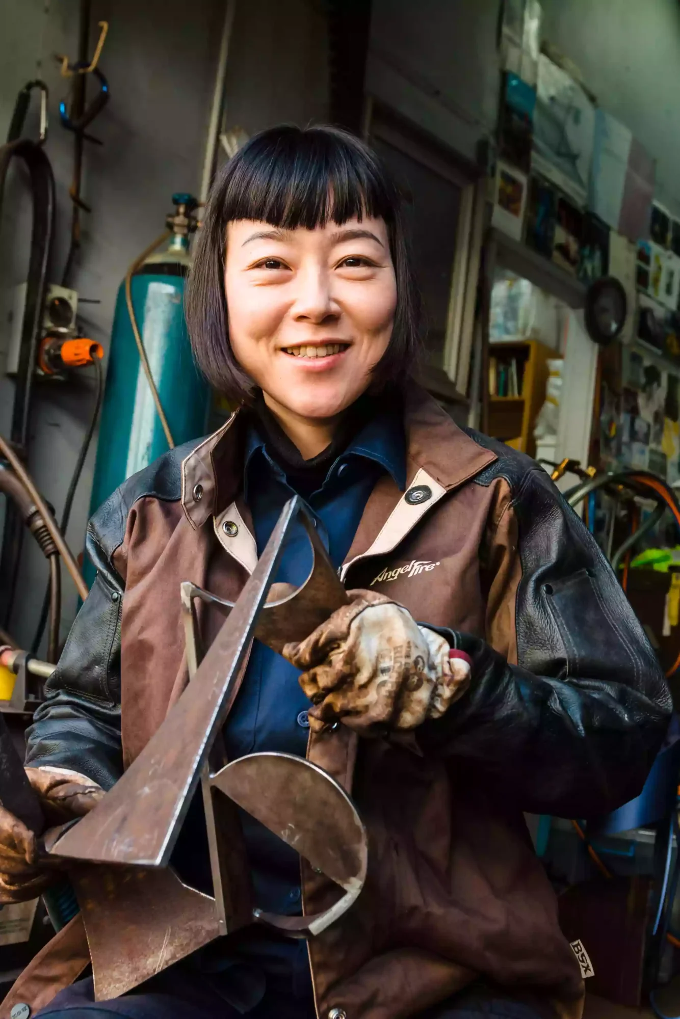 Headshot photo of a woman in her workshop as shot by a Sydney professional headshot photographer