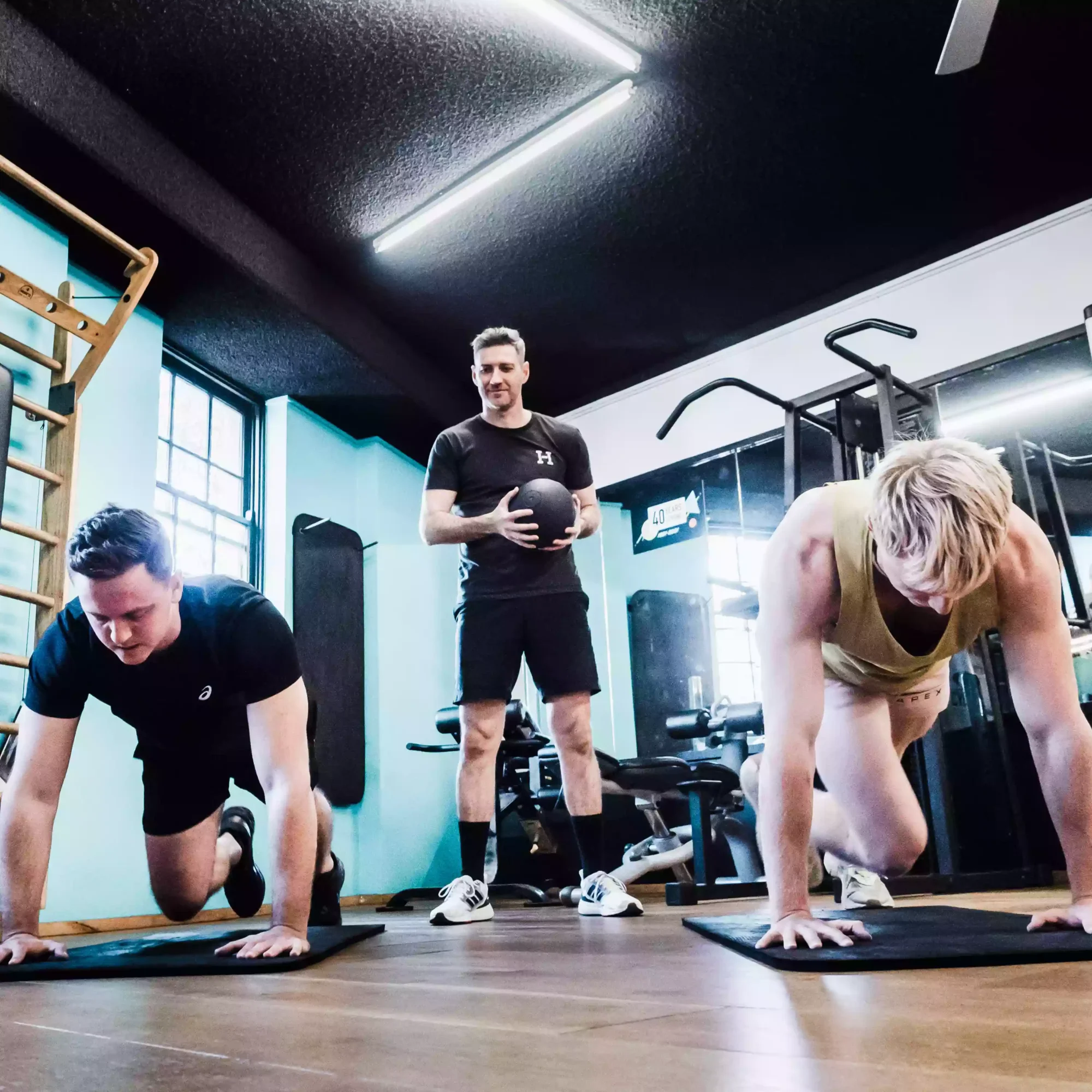 men training at the gym as photographed by a sydney business photographer