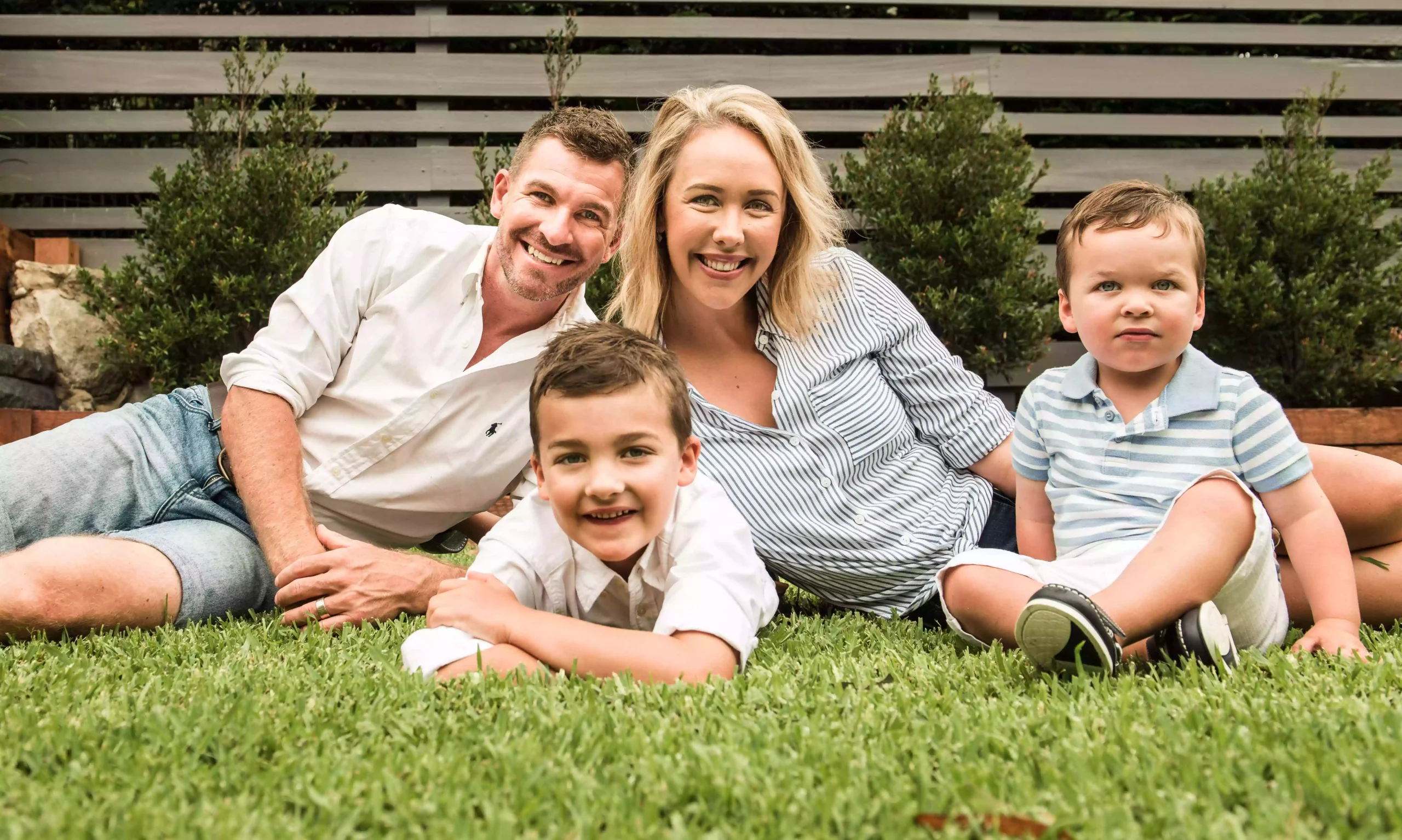 a family photo mum dad and 2 boys as photographed by a Sydney lifestyle photographer